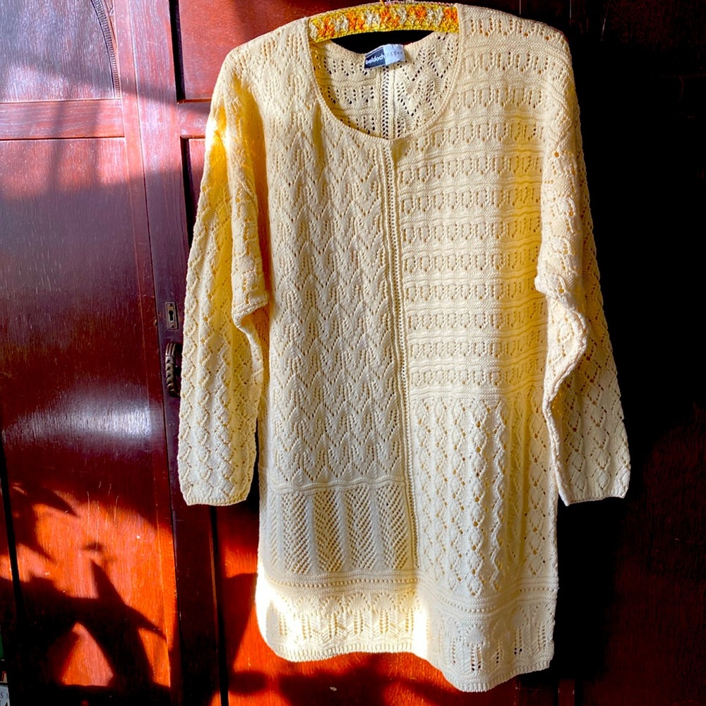 Women’s cream colored, knitted sweater with long sleeves